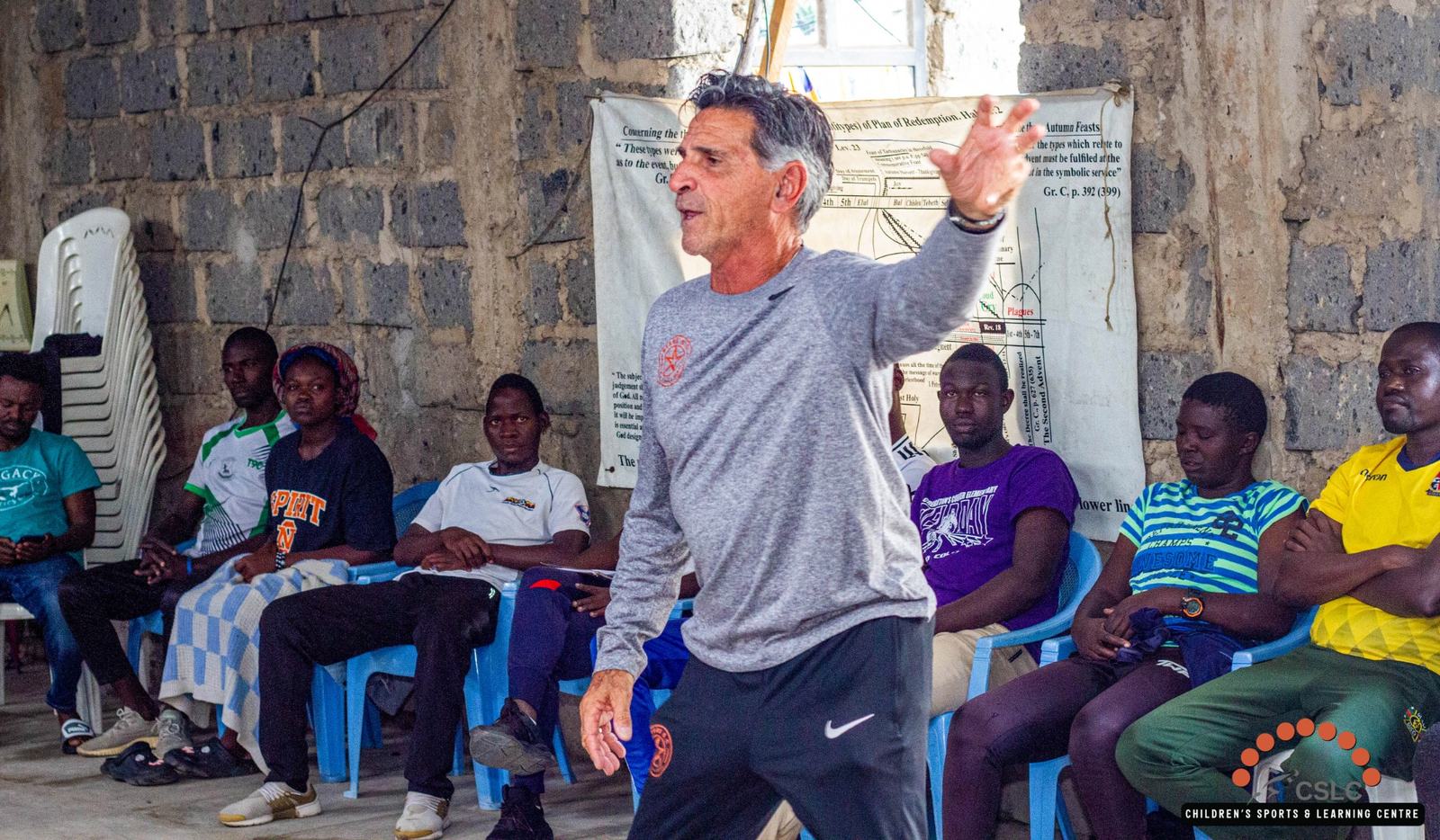 A ministry leader teaching a seated group indoors